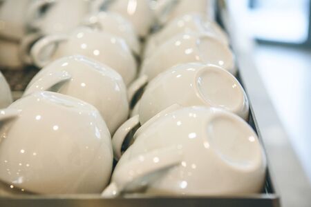 Close up of many white mugs for tea or coffeeの写真素材