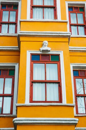 Close-up of an old orange building in the Balat district of Istanbul in Turkey. The houses in this area were built in the 15-18 centuries, not later.の写真素材