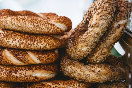 Close up of many traditional turkish bagels called simit. Traditional street food.