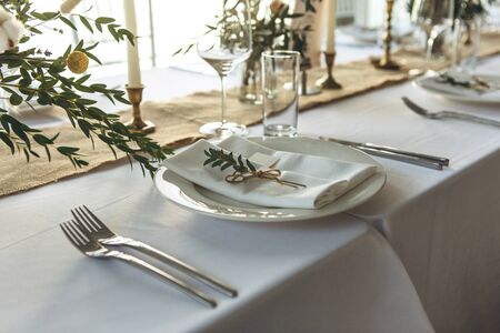 Plate and cutlery. Table setting for a festive event.の写真素材