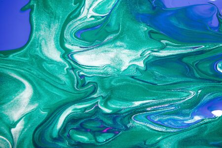 Acrylic paint liquid in trend mint, AquaMenthe and blue color mix background.の写真素材