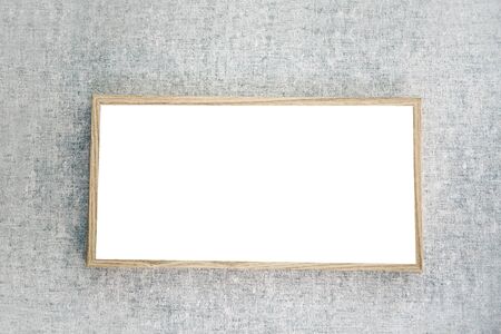 Mock up frame for a picture or photograph on a gray wall in Scandinavian style.の写真素材
