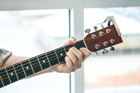The guitarist plays the guitar. Or a person learns to play the guitar.の写真素材