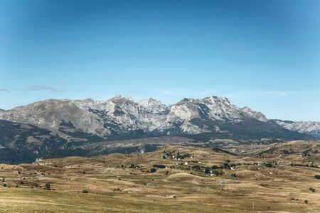 Beautiful panoramic view of the mountains and rural landscape against the blue sky in Montenegro.の写真素材