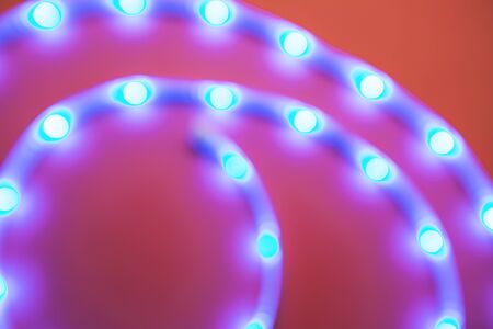 Blurred abstract background fluorescent lamp on a red background.の写真素材