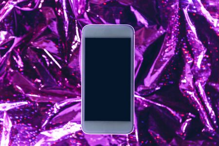 Cell phone mockup with blank screen or copy space on trendy neon background.の写真素材