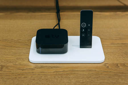 Turkey, Istanbul, December 17, 2019: Apple TV with remote control from the company Apple.のeditorial素材
