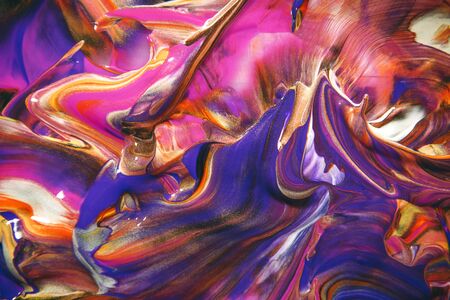 Multicolored acrylic paint flowing fluid trend bright colorful background.の写真素材