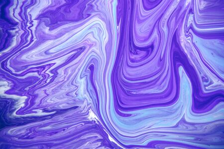 Acrylic paint liquid in trend purple and blue color mix background.の写真素材