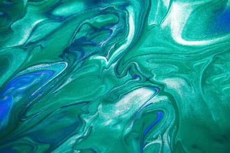 Acrylic paint liquid in trend mint, AquaMenthe and blue color mix background.の写真素材