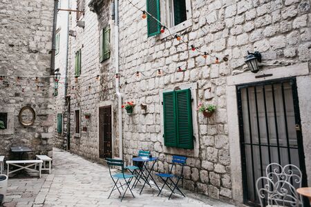 View of the street and an empty street cafe. No visitors.の写真素材