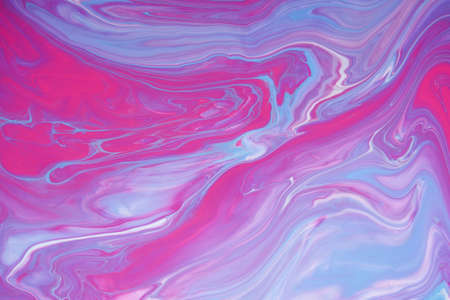 Acrylic paint fluid in trend magenta and pink color mix backgroundの写真素材