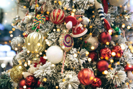 Christmas holiday tree with many toys and balls and holiday lights. Christmas background.の写真素材