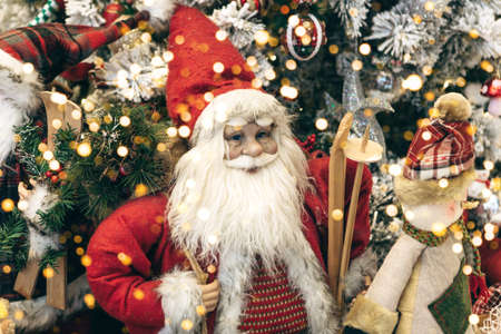 Christmas holiday background with Santa Claus and snowman and other Christmas baubles and lights.の写真素材