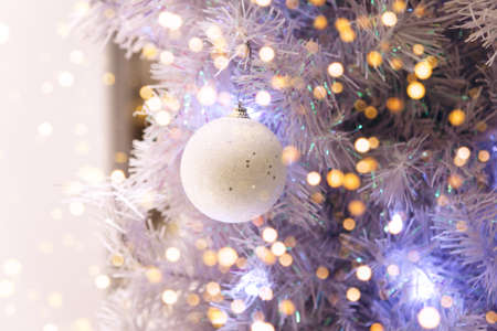 Christmas holiday tree with ball and holiday lights. Christmas background.の写真素材