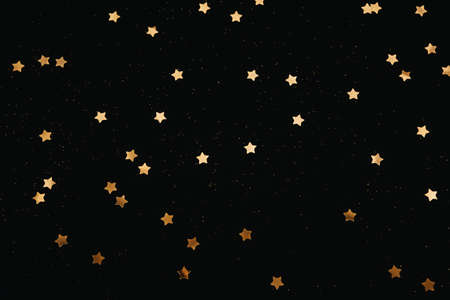 Many golden stars on a dark background.