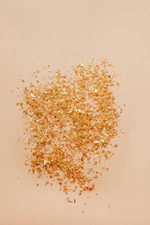 Beautiful festive pink background with golden confetti.の写真素材