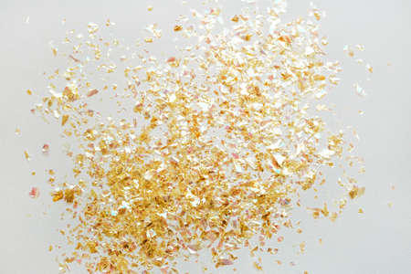 Beautiful festive white background with golden confetti.の写真素材