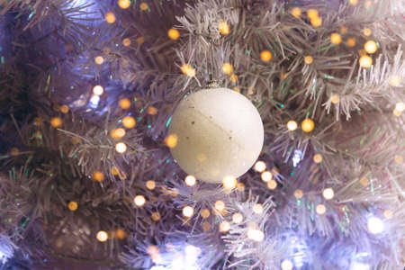 Christmas holiday tree with ball and holiday lights. Christmas background.の写真素材