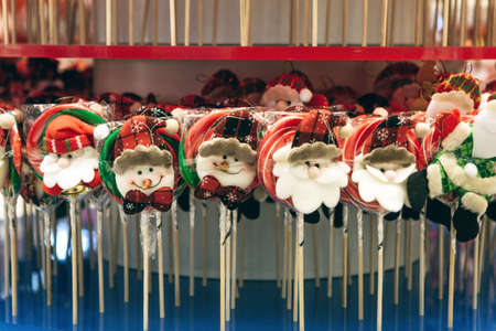 Traditional Christmas lollipops in a row at a Christmas market or shop.の写真素材