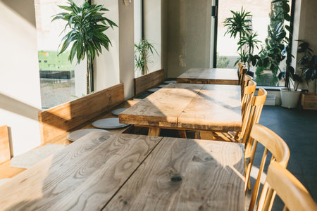 Empty wooden tables and chairs. Rustic interior.の写真素材