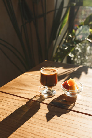 Coffee and sweets on a wooden table in a rustic style.