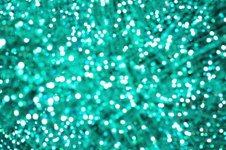 Green Christmas or New Year lights blurred festive background.の写真素材