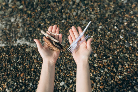 The concept of a persons choice: to preserve nature or use disposable plastic. In one hand, the...