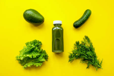 Natural detox green smoothie ingredients on yellow background. The concept of a healthy diet or dietの写真素材