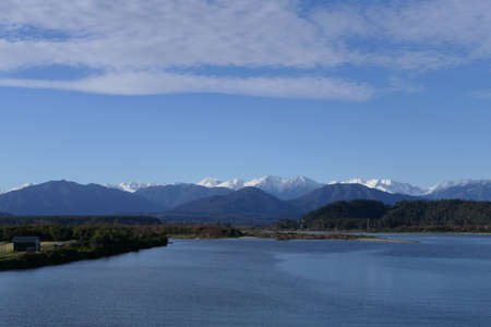 Stream in New Zealand West Coast, Hokitika River with Southern Alpsの写真素材