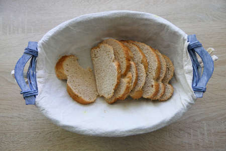 Fresh homemade braid or placed loaf in a bread basketの写真素材