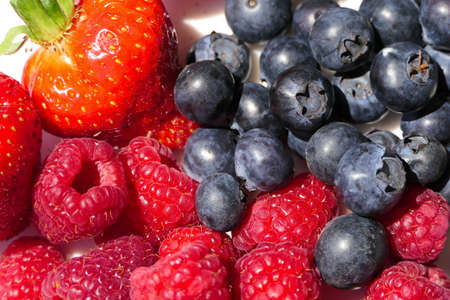 Closeup mixed berries with strawberries, blueberries and raspberries from aboveの写真素材