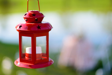 Lantern on the background of the lake. Selective focus.