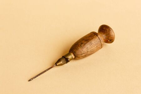 old wooden and metal tool for working woolの写真素材