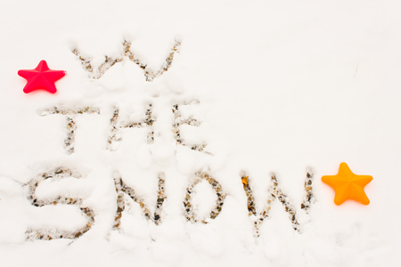 the word w the snow written on an expanse of snowの写真素材