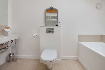 Minimalist luxury white painted bathroom with sink and toiletの写真素材