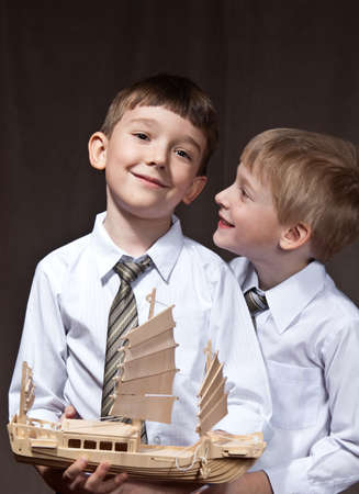 two brothers with shirt and tie. smiling boys with shipの写真素材