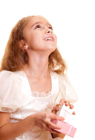 Little girl holding small gift box in handの写真素材