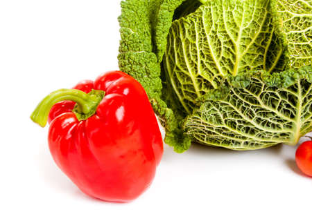 Ripe savoy cabbage and paprica isolated on white backgroundの写真素材
