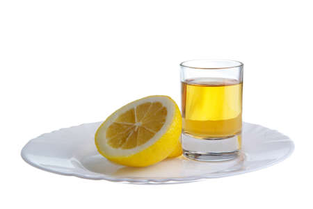 limon with sugar on the white plat and a wine-glass of congacの写真素材