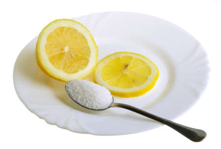 limon with sugar on the white plat and a wine-glass of congacの写真素材