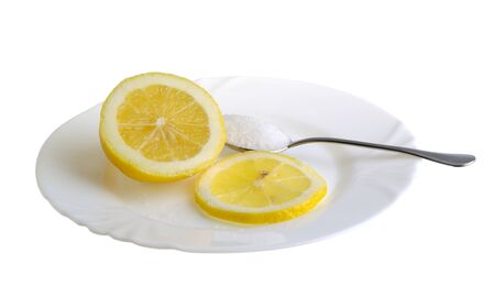 limon with sugar on the white plat and a wine-glass of congacの写真素材