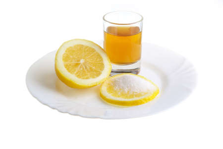 limon with sugar on the white plat and a wine-glass of congacの写真素材
