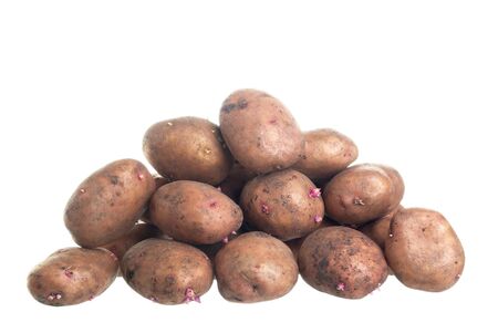 some crude potatoes isolated on white backgroundの写真素材