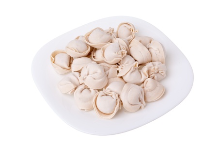 pelmeni on the plate isolated on whiteの写真素材