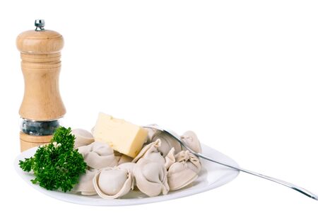 pelmeni on the plate isolated on whiteの写真素材
