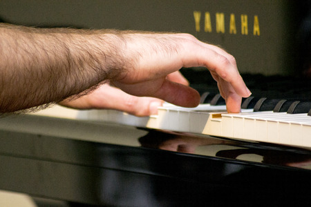 Piano pianist hands playing particular musical instruments with hand player close-upの写真素材