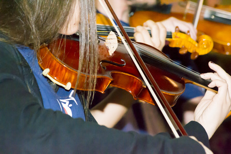 Violinist girl playing the violinの写真素材