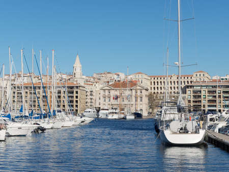 Marseille city hall seen from across the harbor with boats in the foreground, Franceの写真素材