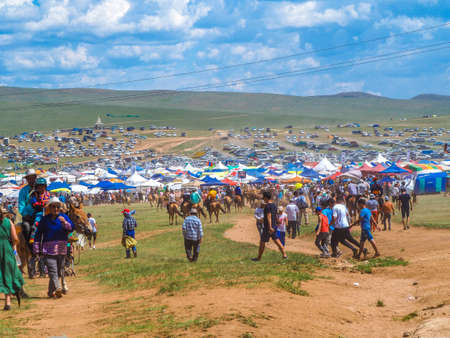 Naadam Festival Horse riding competition. Crowds gather to watch the annual Horse racingのeditorial素材